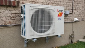 New central air conditioner outdoor unit installed beside a detached home in Dorval